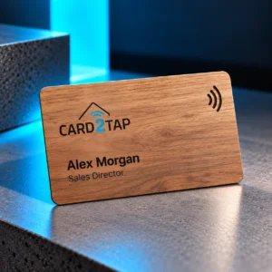 Wooden Card2Tap NFC business card engraved with the Card2Tap logo, the name Alex Morgan and the title Sales Director