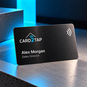 Brushed black metal Card2Tap NFC business card with the Card2Tap logo, the name Alex Morgan and the title Sales Director in white